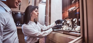 Women in black gloves handling luxury watches